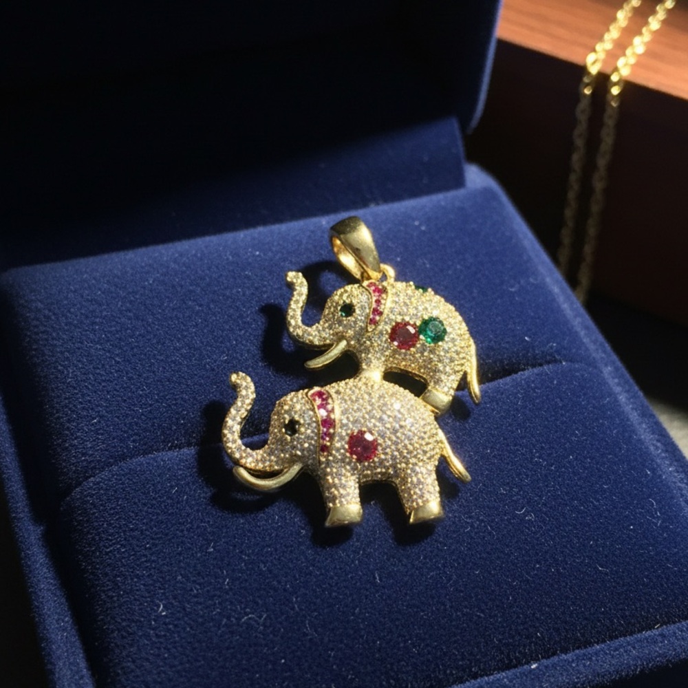 Gold Elephant Pendant Necklace with Red and Green Accents